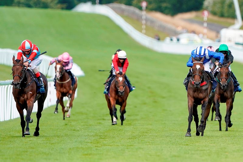 Believe In Love leads home a strung out field in the 1m4f fillies' handicap on day one of Glorious Goodwood